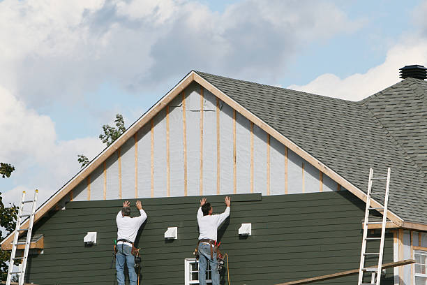 Professional Storm Damage Siding Repair technician working in Rogers, MN
